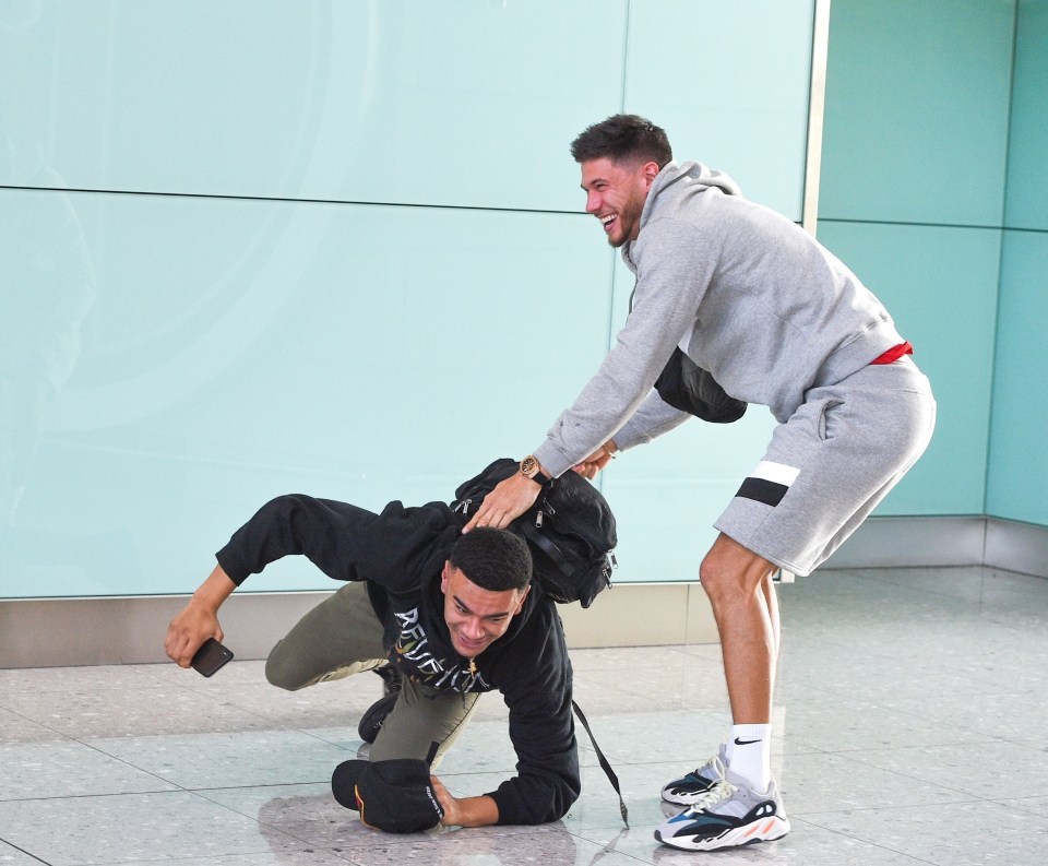 Wes Nelson and Jack Fowler muck about after nearly missing their flight