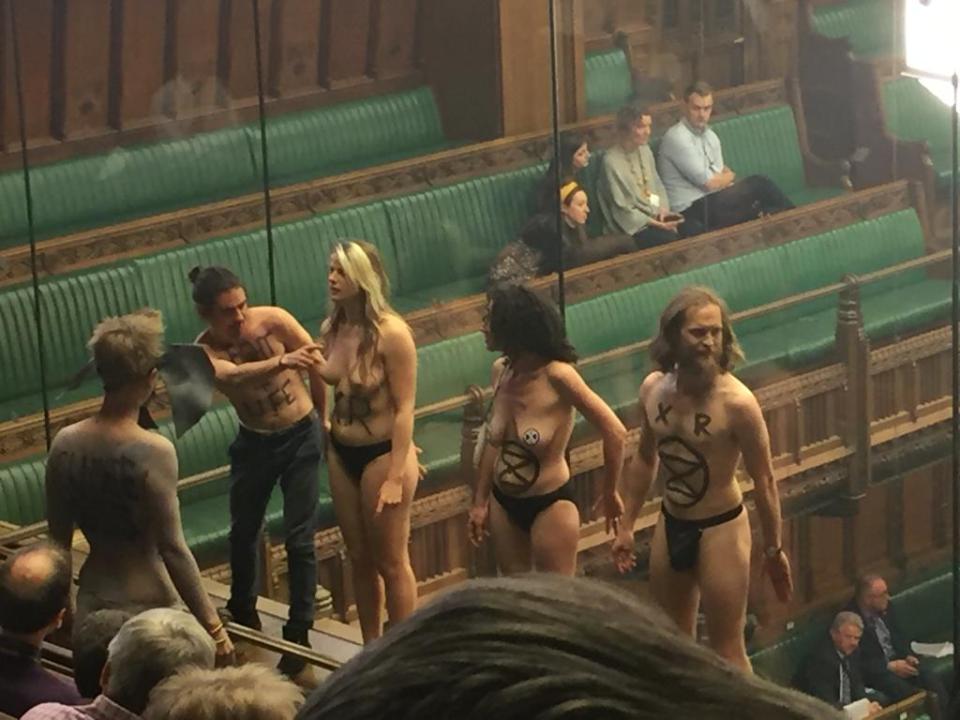  The activists stripped off as MPs were debating Brexit today - and pressed themselves up against the glass