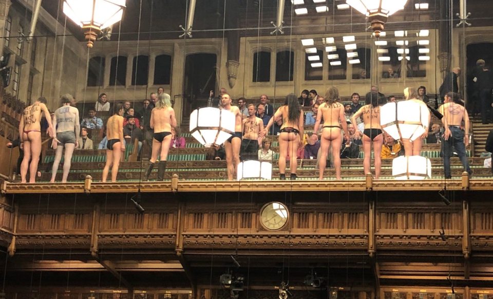  ER climate change activists strip down to their underwear in the House of Commons' public gallery on April 1