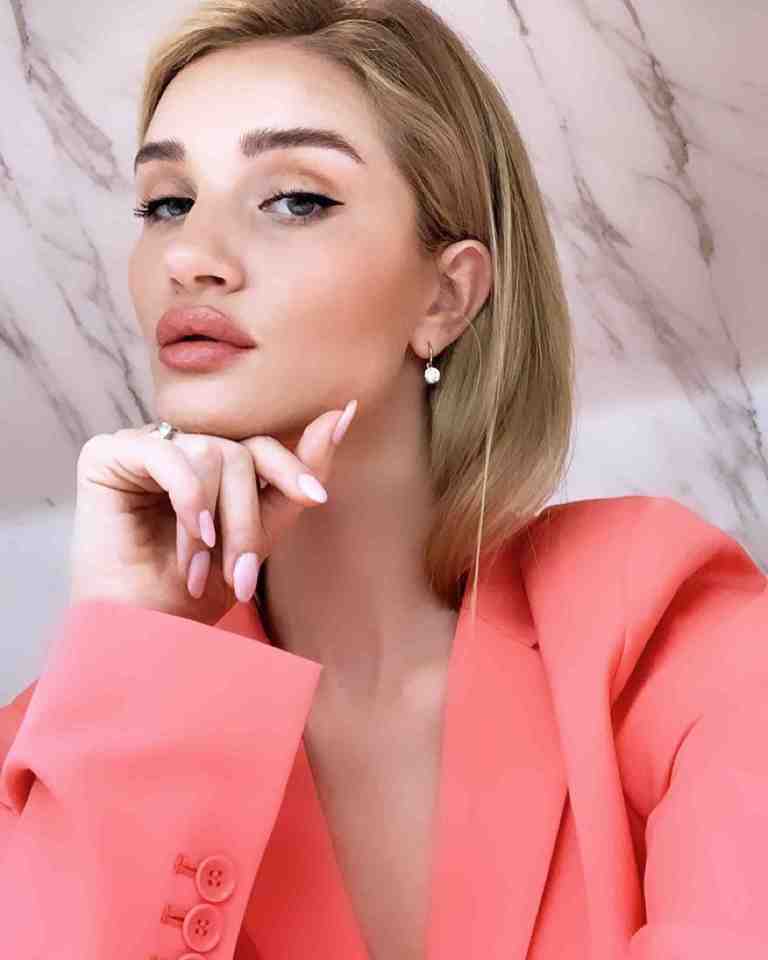  Rosie Huntington-Whiteley showed she means business as she posted a pic of herself wearing a pink powersuit to Instagram