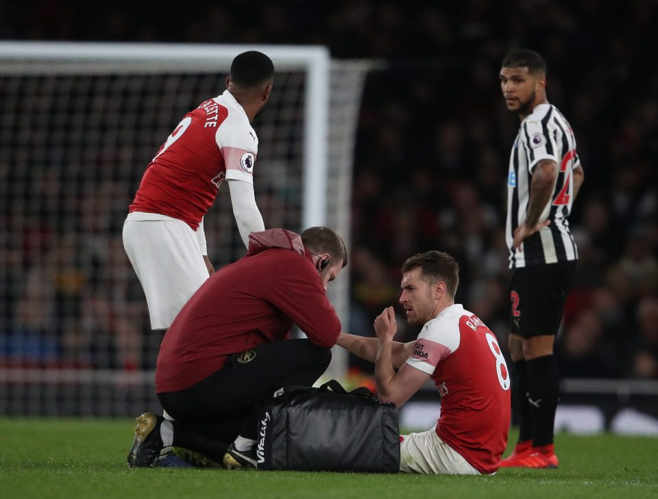  Aaron Ramsey receives treatment from the Arsenal physio