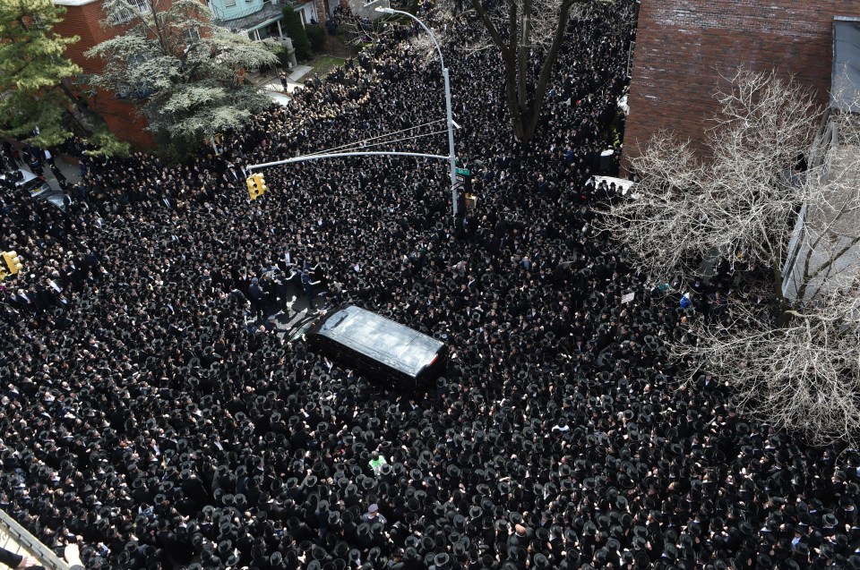  An estimated 100,000 Hasidic Jews crowded into Brooklyn's streets for the funeral of the revered rabbi