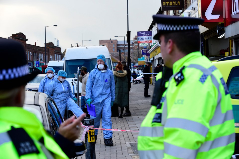 Forensic investigators on the scene in Harrow, north west London, after a man died of fatal ‘stab or slash wound’