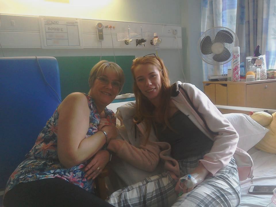  Bobbie Jarvis with her mum in hospital as she learns to walk and use her left arm again