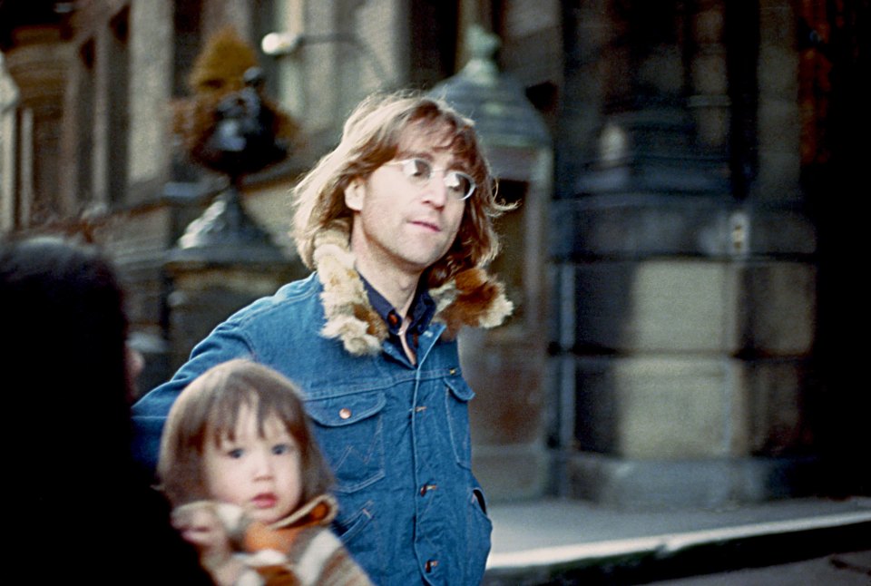  John Lennon is pictured with a young Sean Ono Lennon, in New York City in 1977