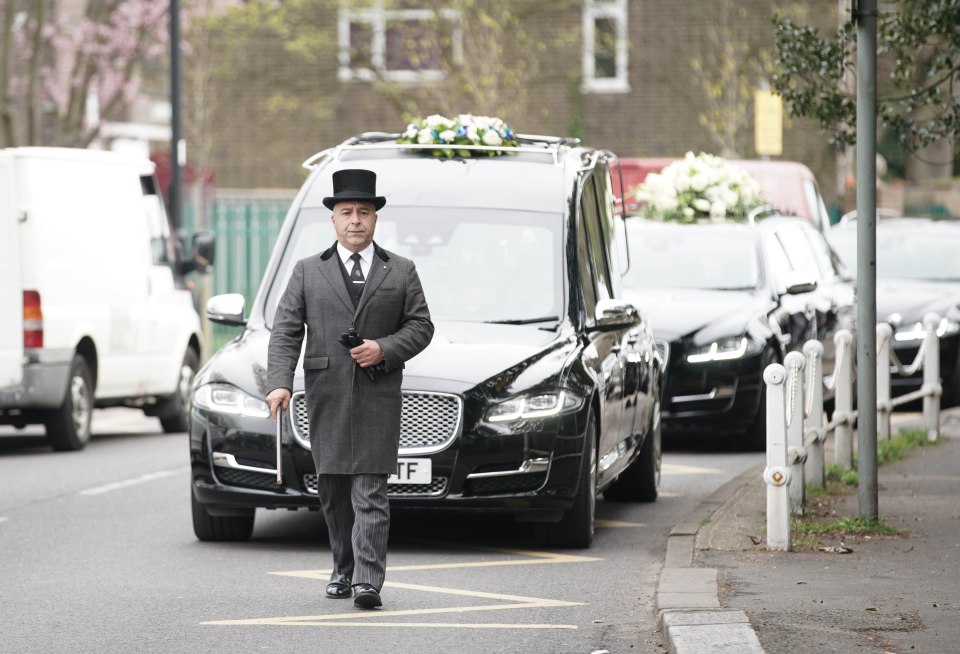  The hearse arrives outside the church for the funeral of Mike Thalassitis