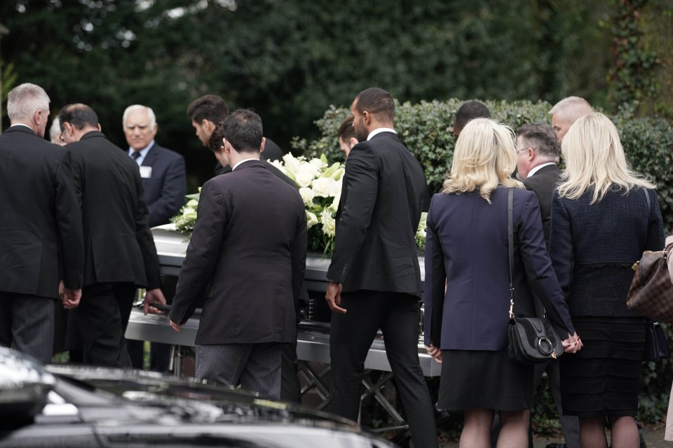  Mike's coffin is led into the church by loved ones