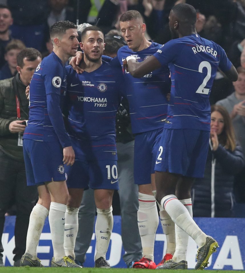  The playmaker is congratulated by his team-mates after single-handedly leading Chelsea to victory