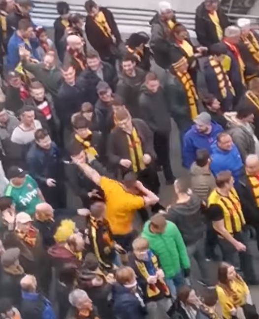  The Wolves fan launches a fierce assault on a Watford fan outside Wembley