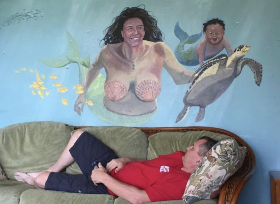  The mural seems to contain a breasted man with a turtle and his young son