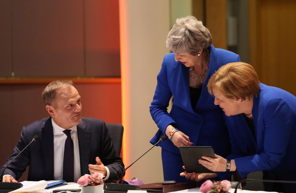  PM May sharing a joke earlier with Donald Tusk and Angela Merkel