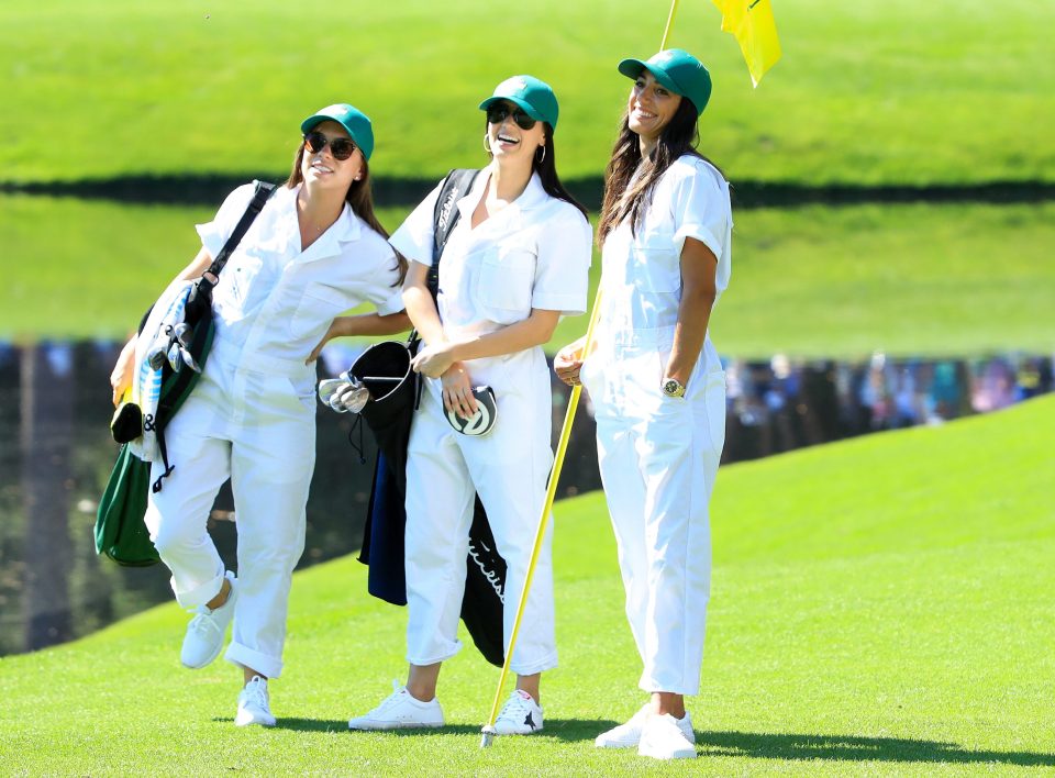  Annie Verret's wife Jordan Spieth (left), Justin Thomas' girlfriend Jillian Wisniewski (centre) and Rickie Fowler's girlfriend Allison Stokke (right) all put on the caddie outfit on Wednesday