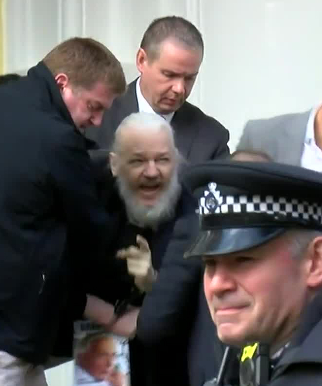  Cops pulled Julian Assange from the embassy this morning