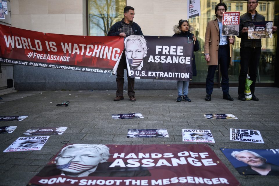  Supporters carried banners and placed others on the ground to show their solidarity with Assange