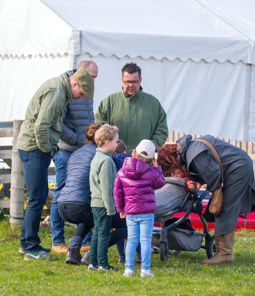  The two families appear to coo over Lena in the pram