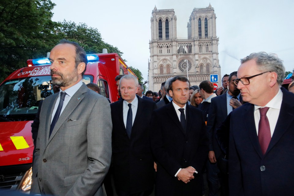  Macron attends the scene outside the cathedral which has been devastated by a raging fire this evening