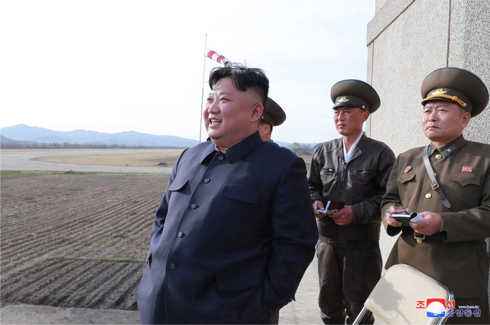  North Korea has fired a new short-range missile today, pictured is despot Kim Jong-un watching combat flight drills