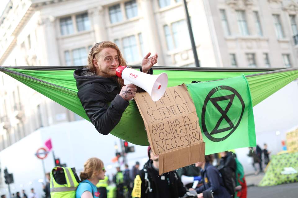  A climate change activist in a hammock occupying Oxford Circus yesterday