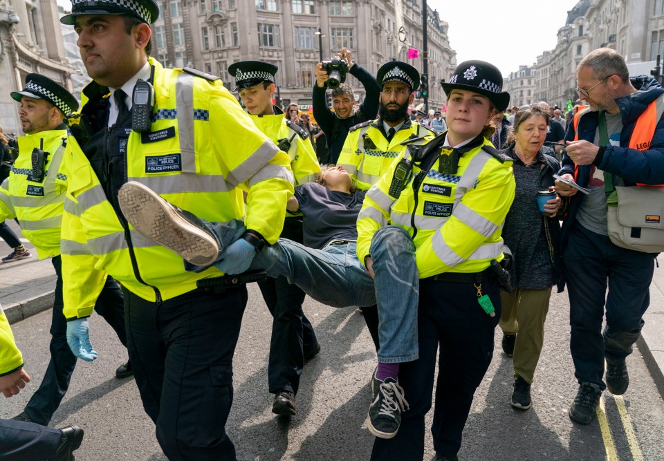  Extinction Rebellion protesters are carried from Oxford Circus as part of the police operation to move on demonstrators this week