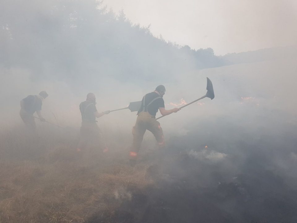  Thick black smoke billowed over the moorland