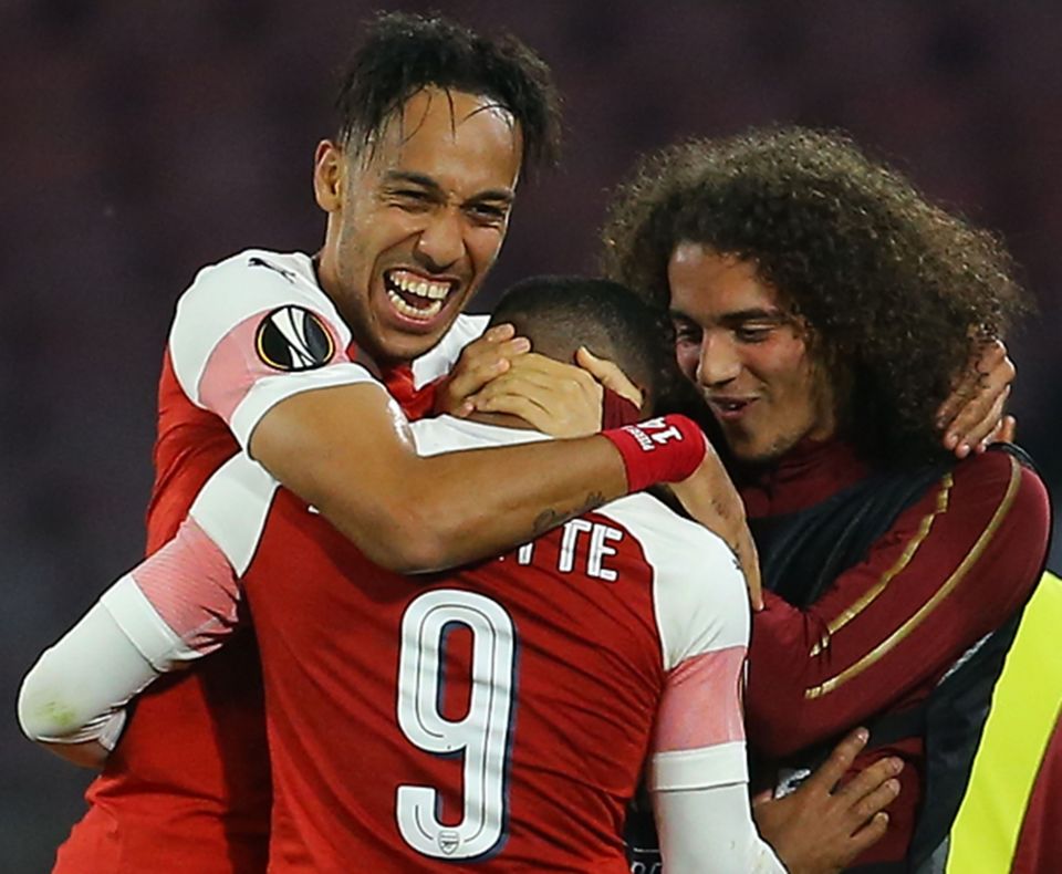  Arsenal celebrate Alexandre Lacazette's free-kick that sent them into the semis