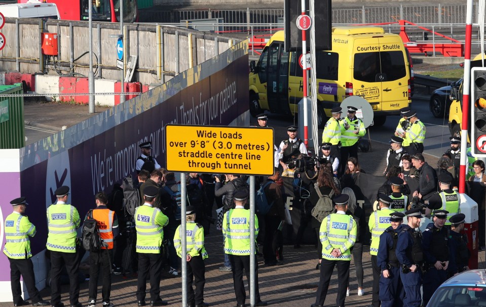  Cops faced demonstrators as they arrived at Heathrow on Friday