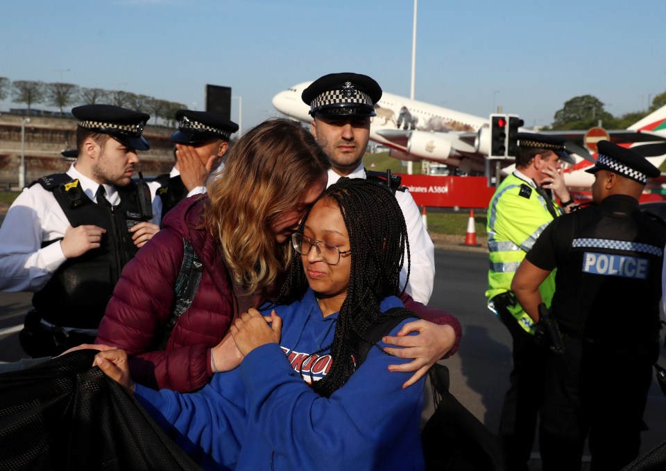  Members of the group Extinction Rebellion cried as they assembled at Heathrow today