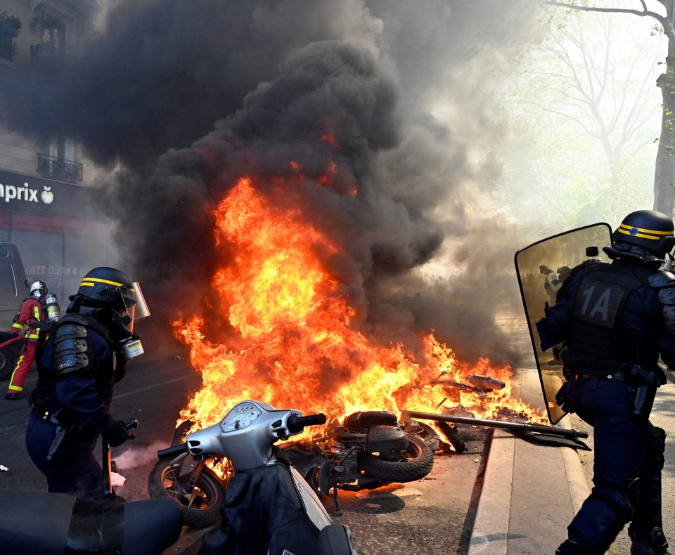  Protesters burn scooters during the demonstrations in Paris today