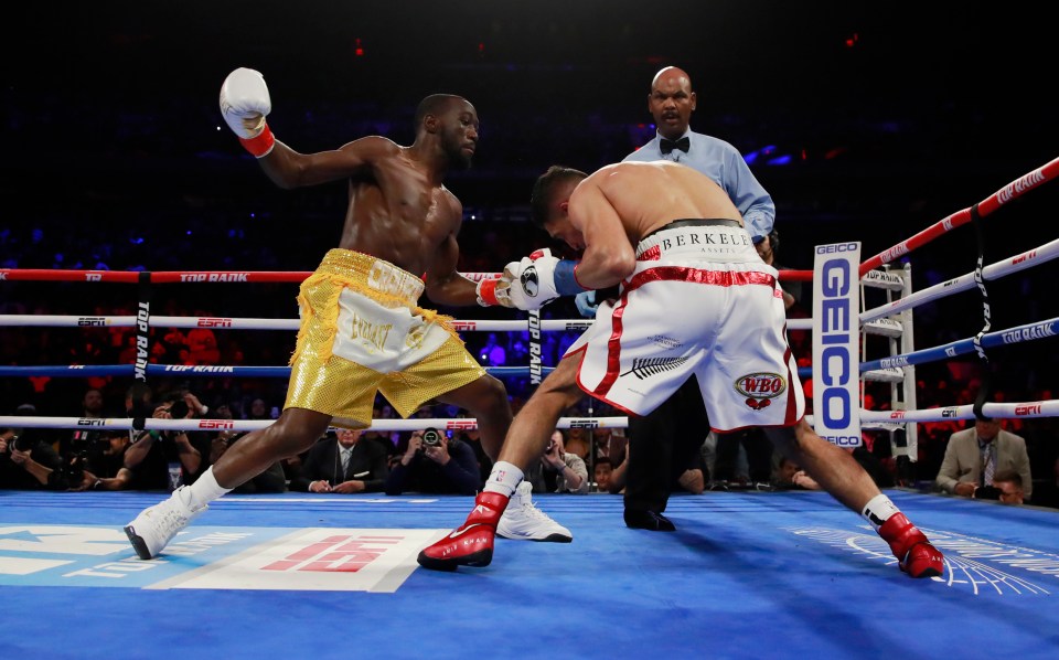  Terence Crawford lands a big shot on Amir Khan during a one-sided fight