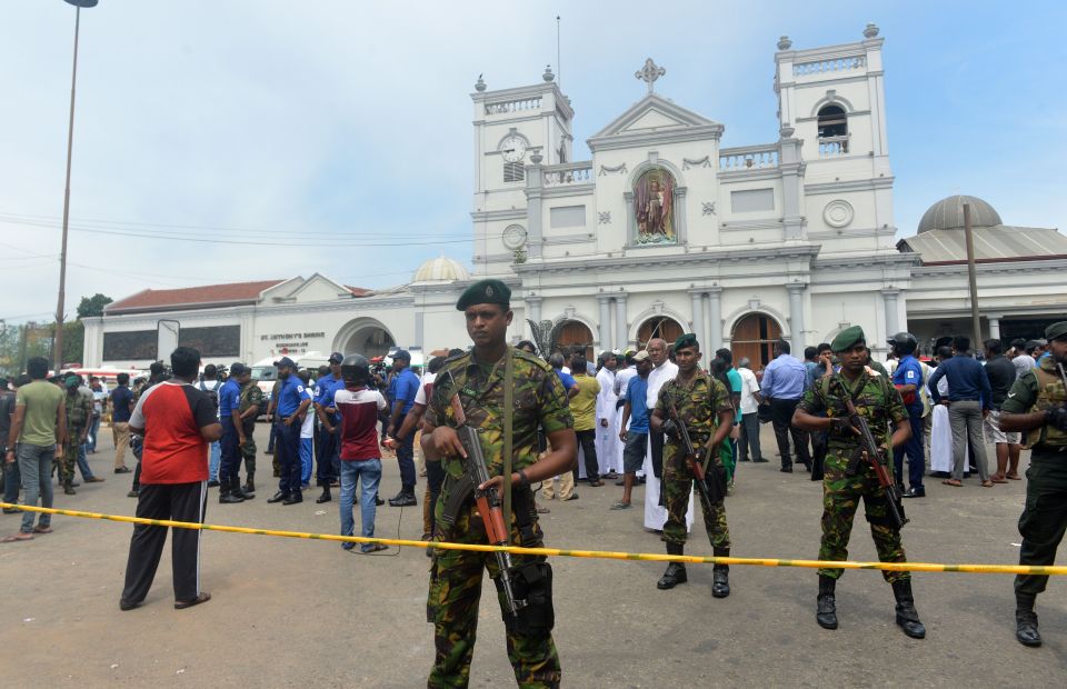  Sri Lankan security personnel keep watch outside a church premises following a blast at the St. Anthony's Shrine on April 21