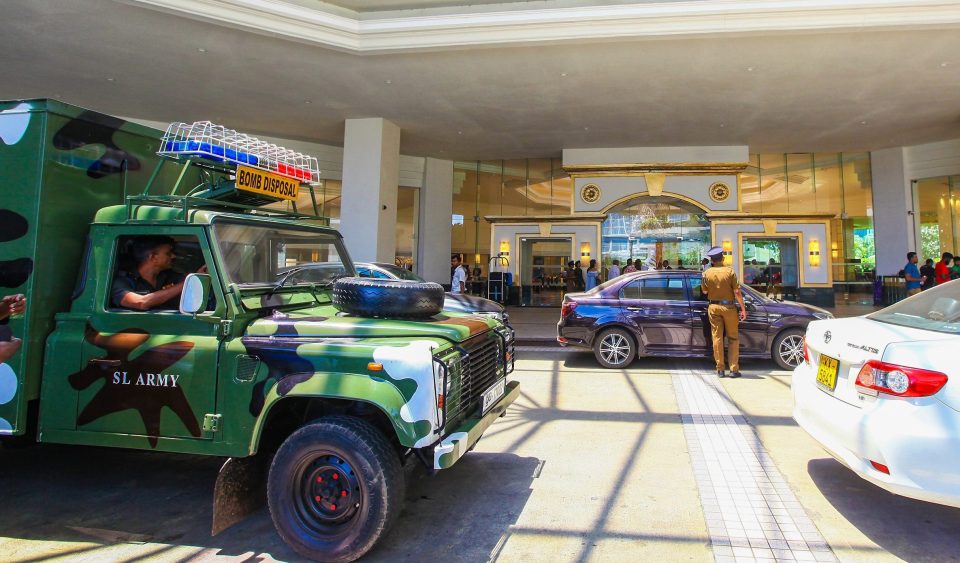  Security forces inspect the scene after the deadly blast at The Cinnamon Grand Hotel