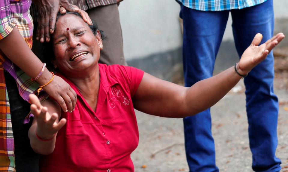  Devastated locals weep in the aftermath of the horrendous attacks