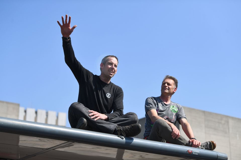  Earlier in the day, Stott (left) and fellow environmentalist Chris Packham, 57, gave speeches from the top of a bus stop