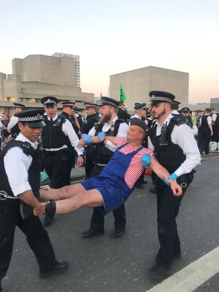  As the afternoon continued, a number of exhausted-looking protesters were placed in the back of police vans while officers encircled a hard-core group who refused to leave