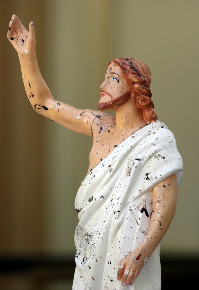  Blood stains are seen on a statue of Jesus Christ at St. Sebastian Catholic Church, after bomb blasts ripped through churches and luxury hotels