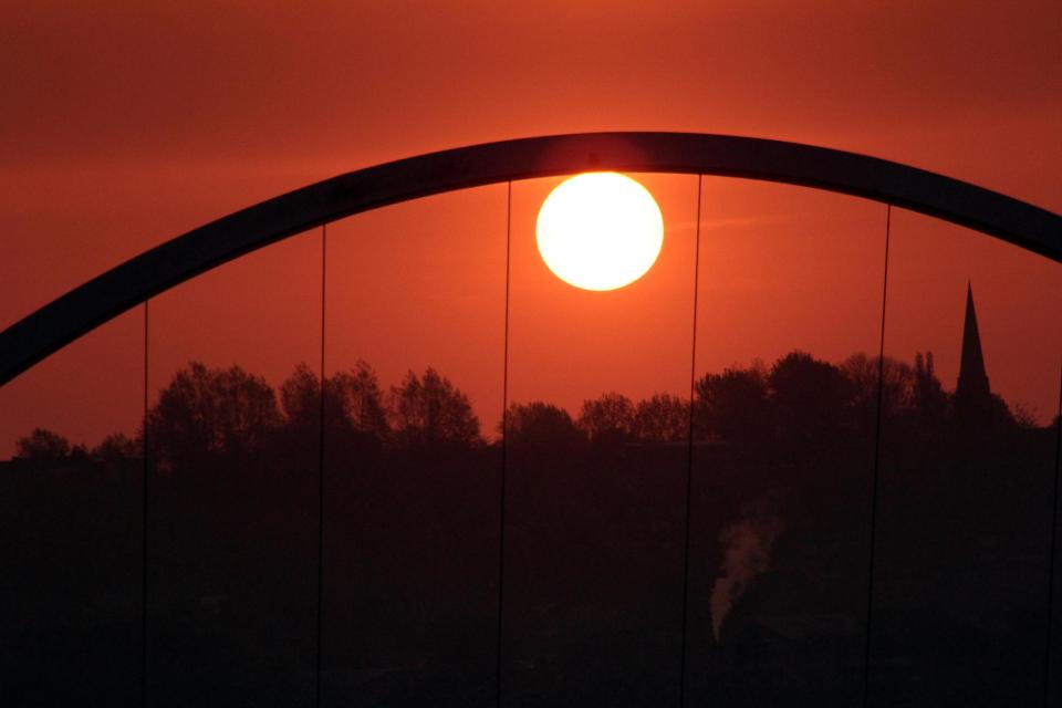 An orange sky as the sun rises in Newcastle Upon Tyne today