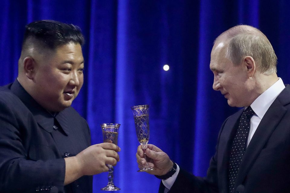  Putin and Kim share a drink during the historic meeting