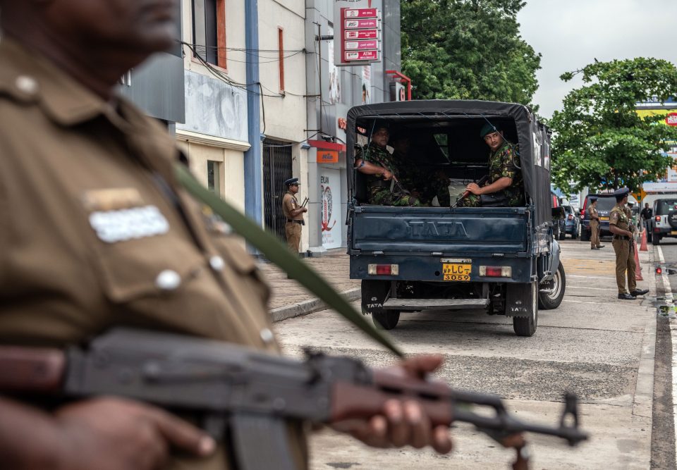  Soldiers and armed police officers guard the area near Dawatagaha Jumma Masjid ahead of Friday prayers