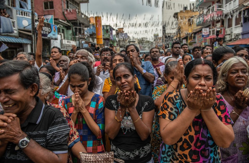  Emotions ran high yesterday as peopled prayed in the street near St Anthony's Shrine one week on from the attacks that killed over 250 people