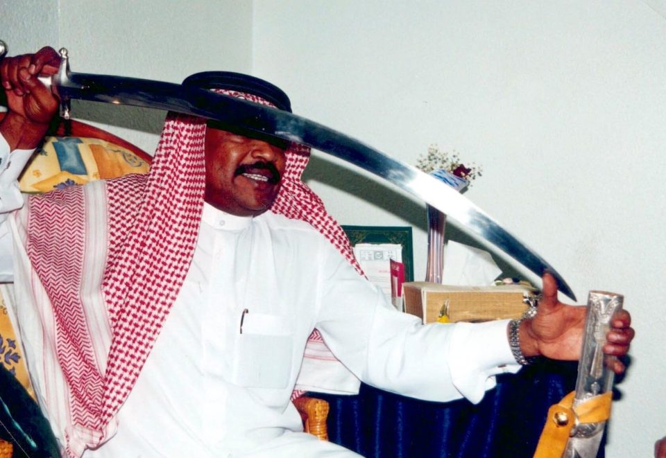  A Saudi executioner shows of his razor-sharp sword