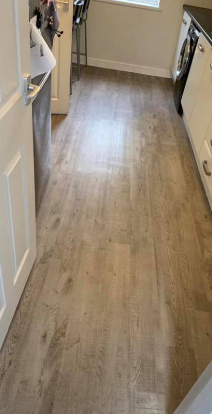 Kim Stoner spent just £50 and brand new flooring for her kitchen using vinyl planks from B&Q