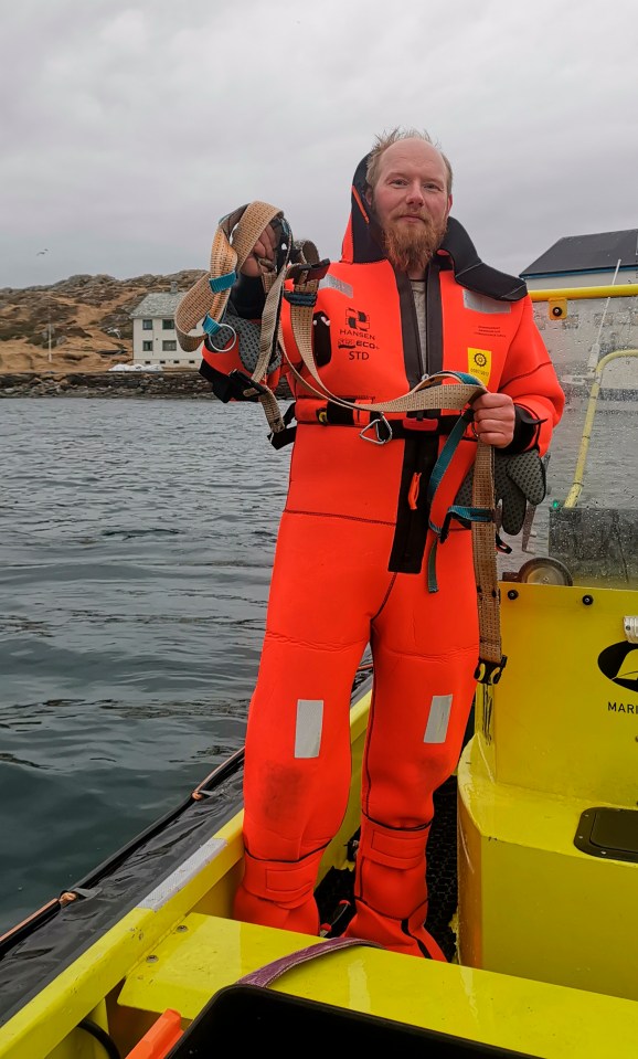  Norwegian Joergen Ree Wiig holds the whale harness after it was removed