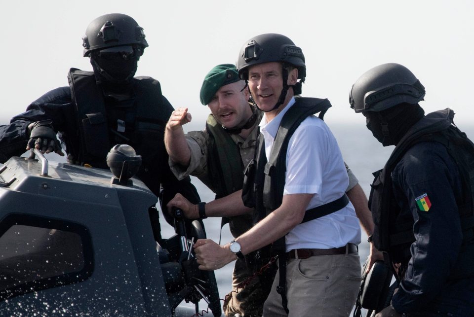  The Foreign Secretary steers a boat with the British Royal Marines