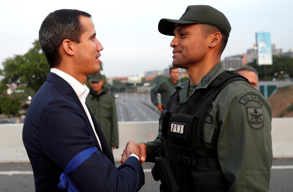  Venezuelan opposition leader Juan Guaido puts on a united front a with a military leader