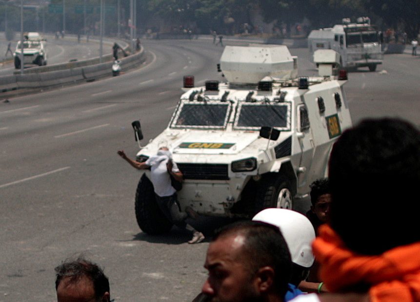  The protester is mowed down by a Venezuelan National Guard troop carrier