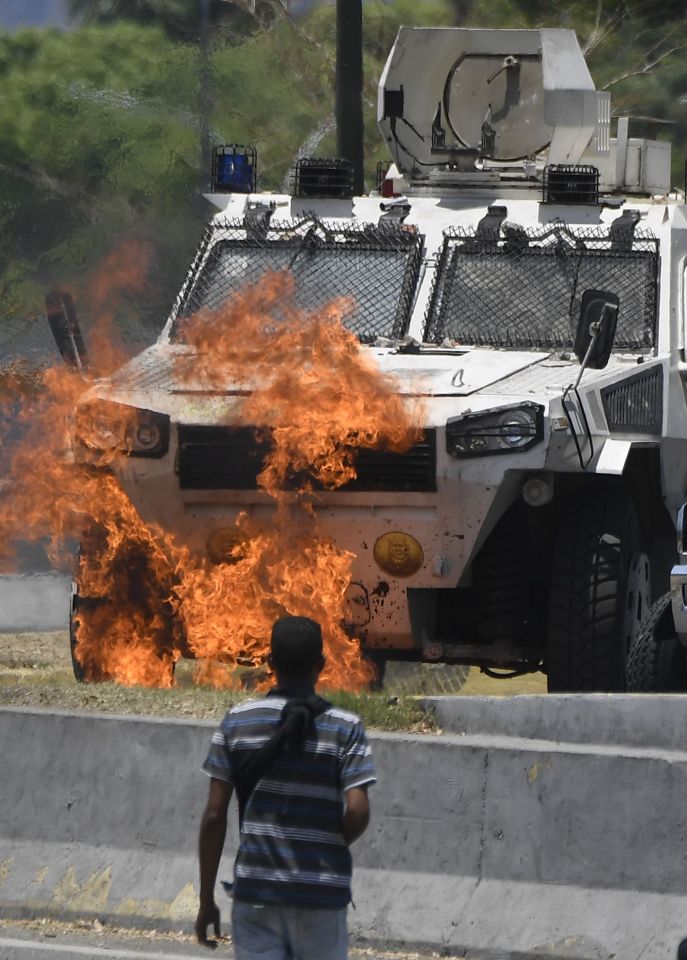  Demonstrators hit back with a petrol bomb