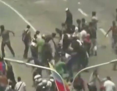  Protesters rush to help those injured and crushed by the huge vehicle