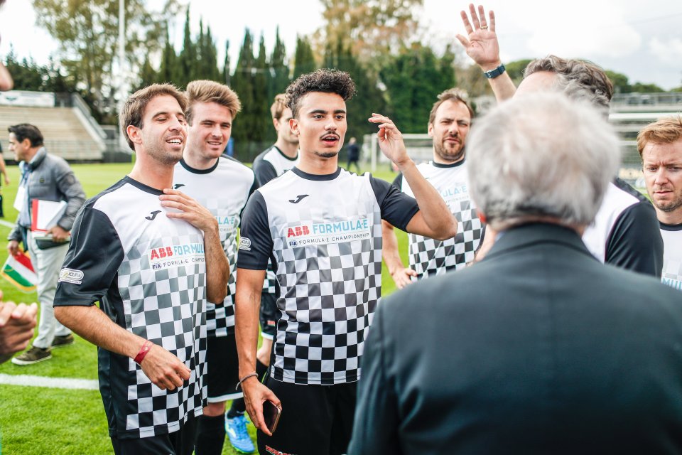  Pascal Weihrlein (centre) stood with his Formula E rivals ahead of kick-off