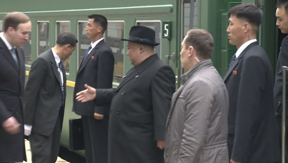  Kim climbs off the train after arriving in the Russia city of Vladivostok