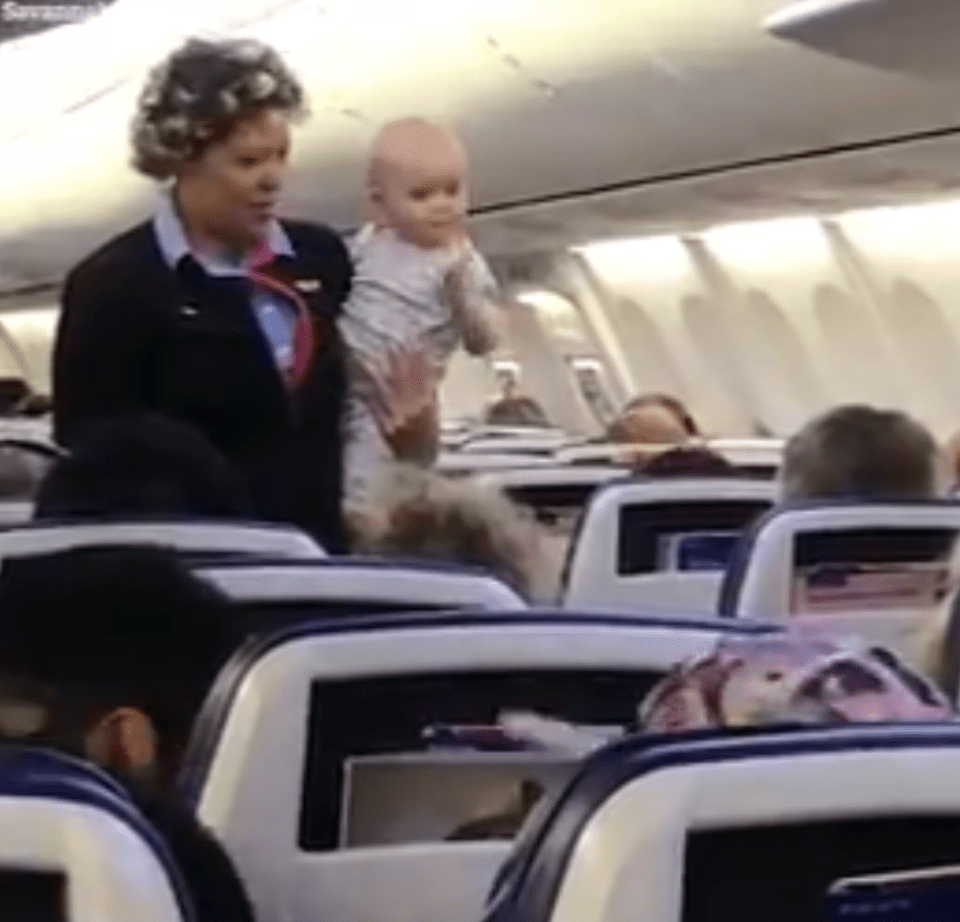  The air hostess carried 19-month-old Brittain up and down the plane to help out exhausted mum Savannah Blum